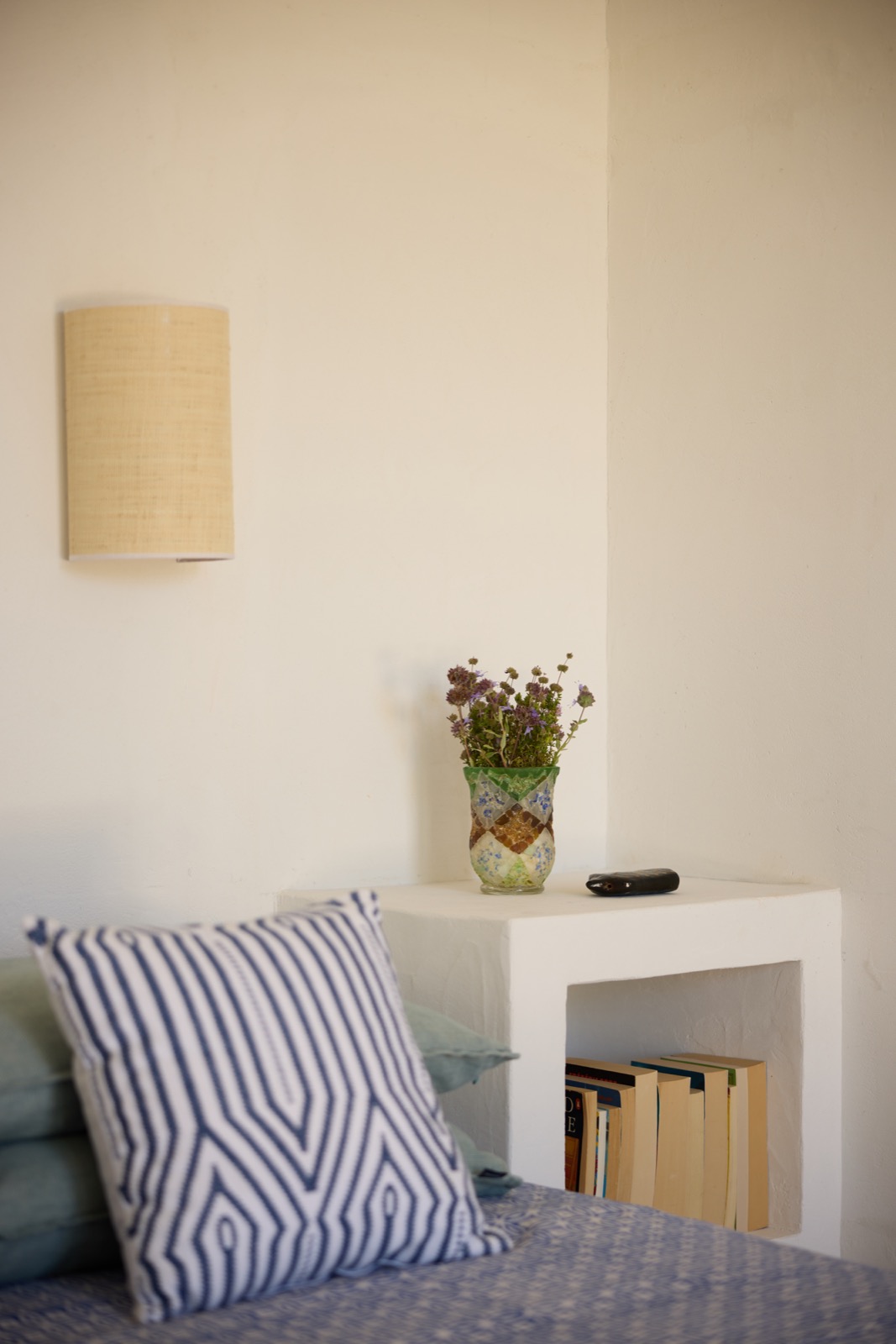 Bedroom nightstand detail with dried flowers